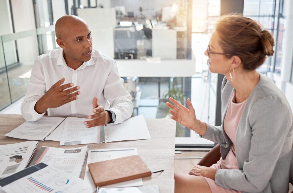 Financial advisor, man and woman in office with documents to review finance report or b2b investmen