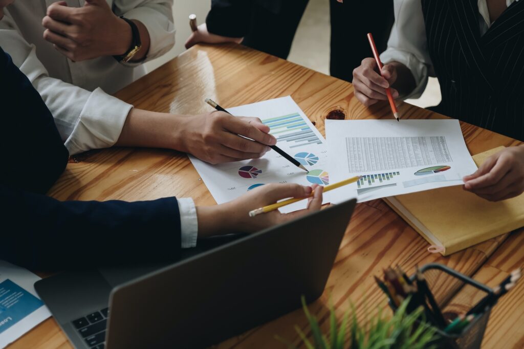 financial advisory services. Group of business advisor showing plan of investment to clients in the